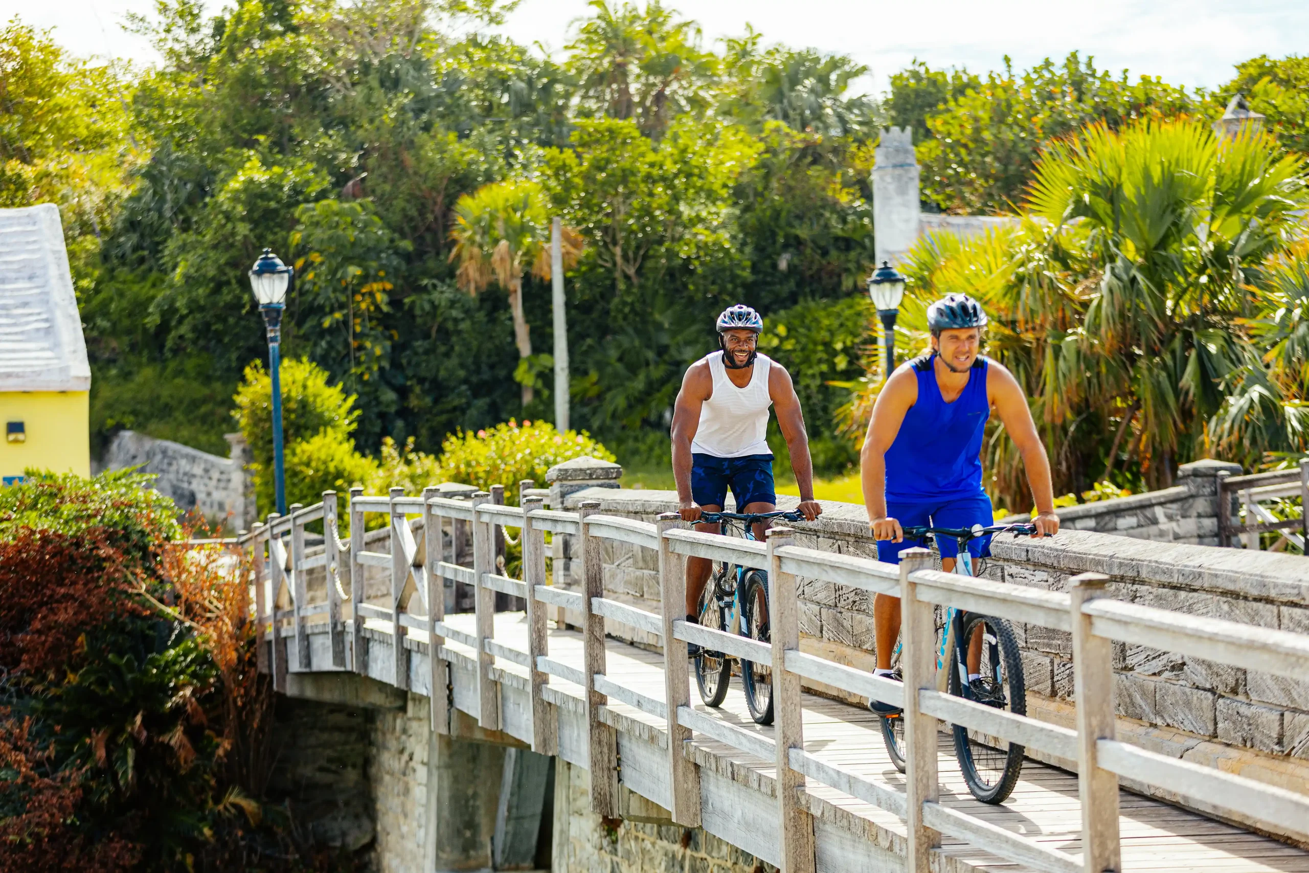 Two bike riders crossing Somerset Bridge Bermuda